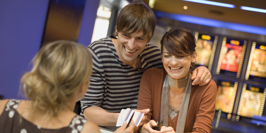 Happy couple gets cheap UK rail tickets.